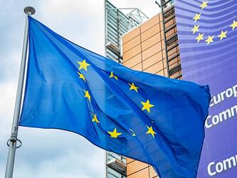 european flag next to european commission building in Brussels